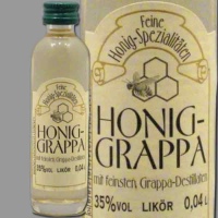 Diese edle Mini-Flasche Honig-Grappa (35% vol., 0,04 l)...
