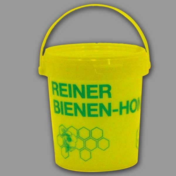1-kg-Honigeimer in leuchtendem Gelb mit grünem Aufdruck „Reiner Bienen-Honig“. Robustes Design, ideal für die praktische und attraktive Honigaufbewahrung.